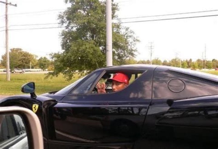  Pharrell Williams in his Black Ferrari Enzo